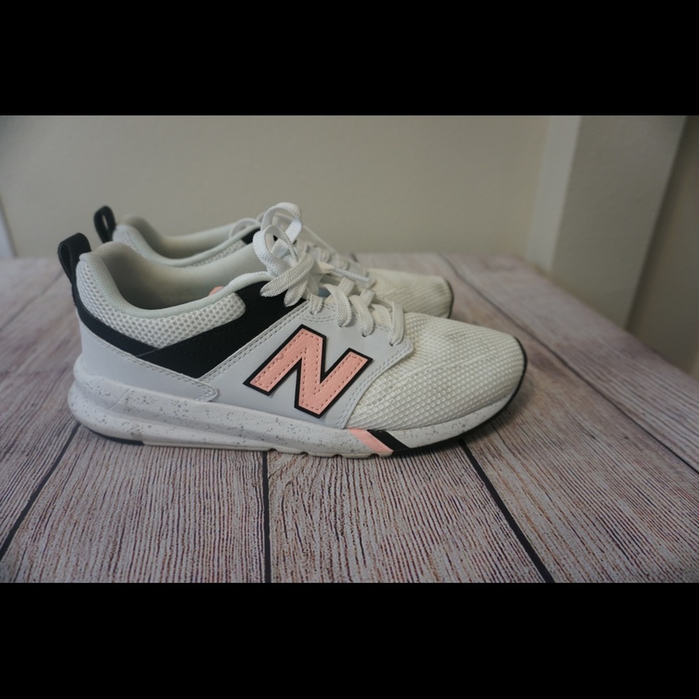 White and Pink New Balance shoes